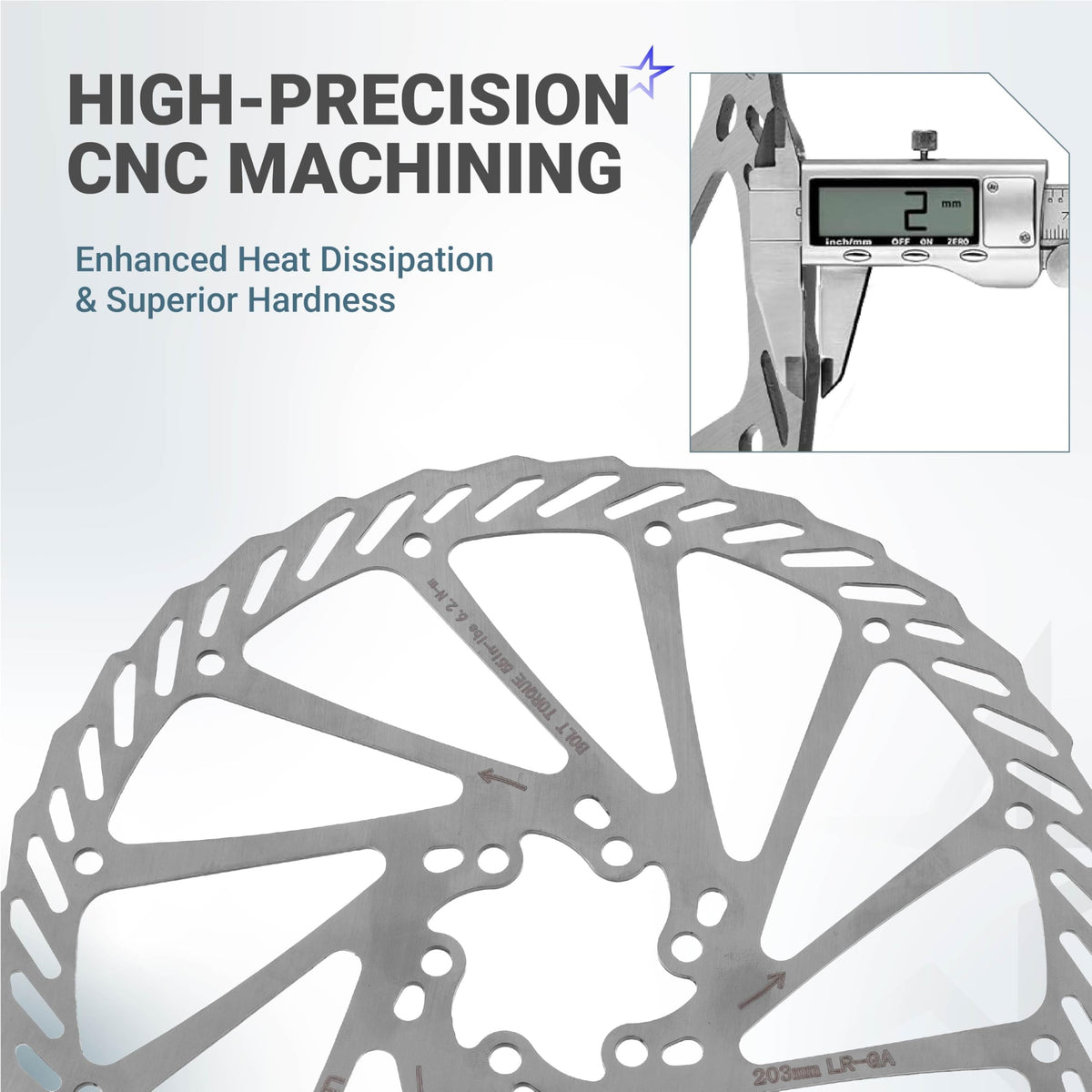 Close-up of 203mm stainless steel bike disc brake rotor being measured with a digital caliper for thickness.