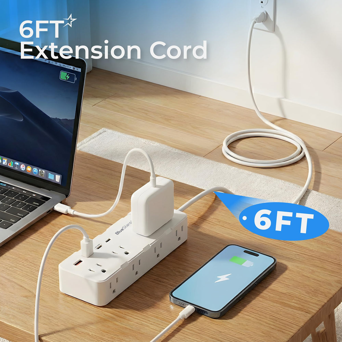 6ft extension cord power strip with AC outlets and USB ports charging a laptop and smartphone on a desk.