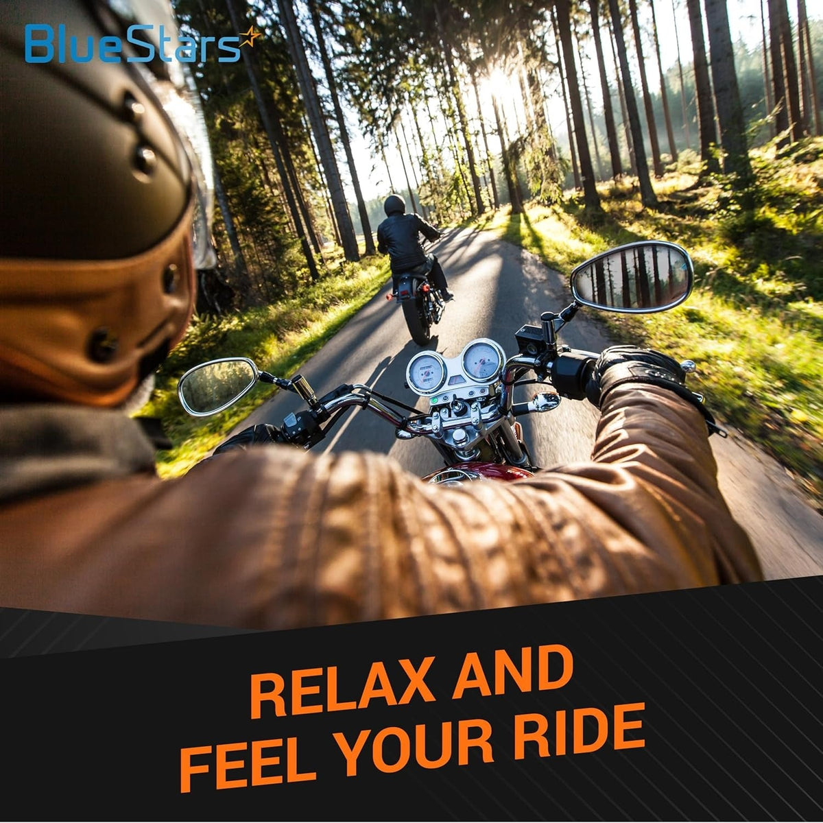 Motorcyclist riding a cruiser bike with 1-inch hand grips on a scenic forest road.