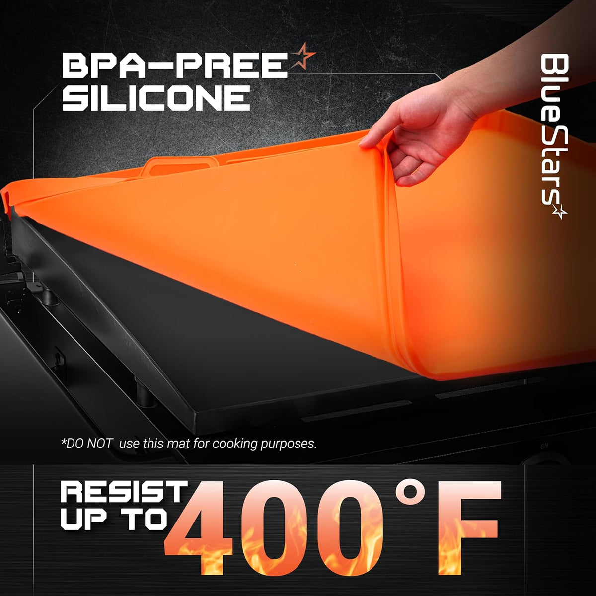 Hand lifting an orange 22-inch BPA-free silicone griddle cover off a black griddle surface.