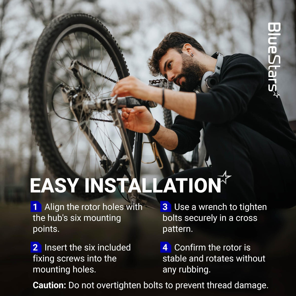 Cyclist installing a 160mm stainless steel disc brake rotor on a bike wheel using six bolts.