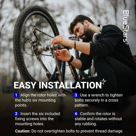 Cyclist installing a 160mm stainless steel disc brake rotor on a bike wheel using six bolts.