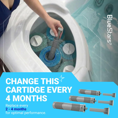 Hand installing a grey hot tub mineral cartridge into a spa filter system.