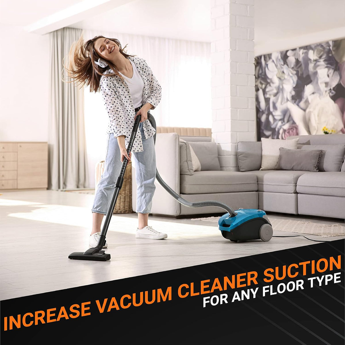 Woman using a vacuum cleaner in a living room to demonstrate improved suction power for floor cleaning.